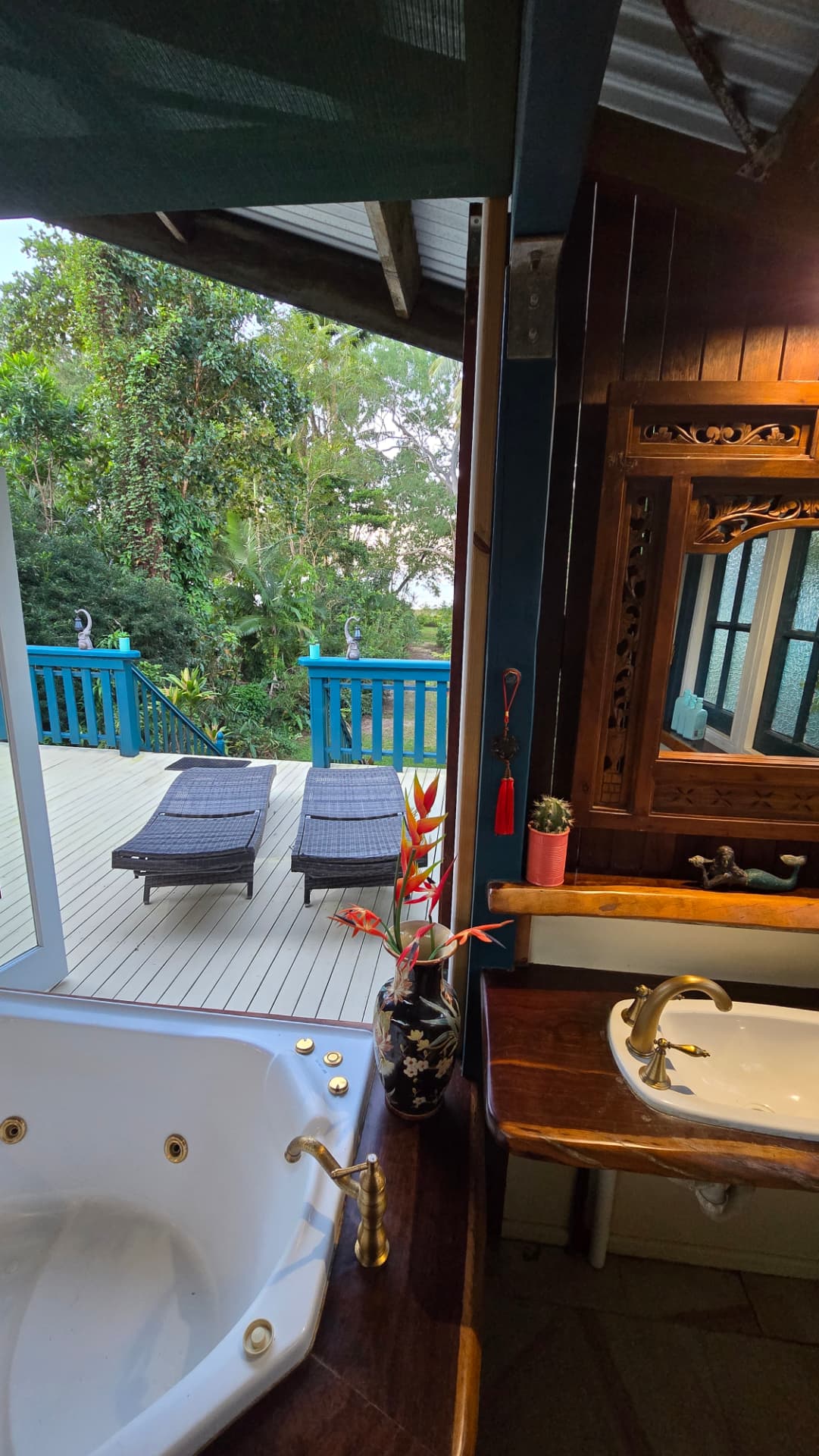 Spa bath and shady chaise lounges on the timber deck
