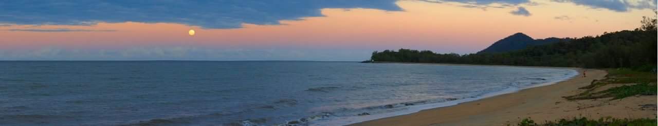 Moon rising over Bramston Beach at dusk