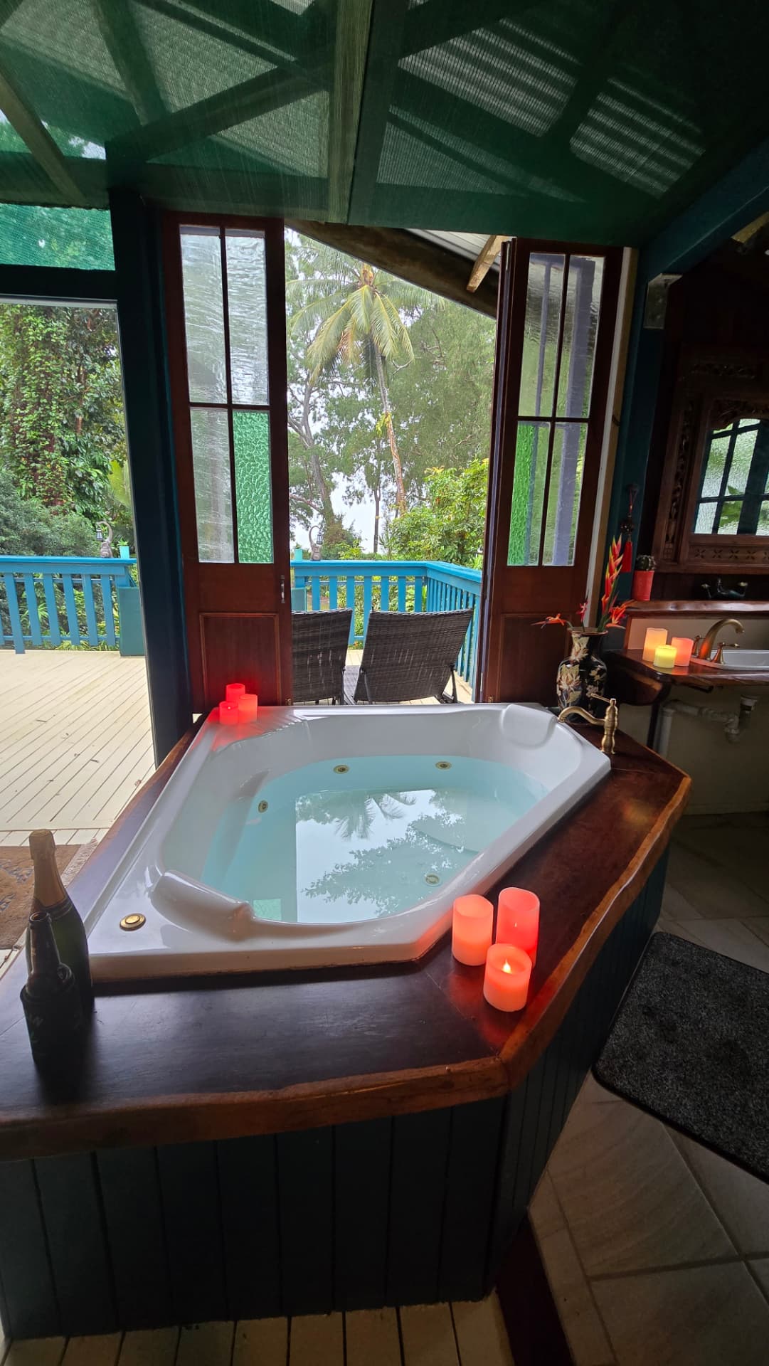Spa bath styled with candles and champagne