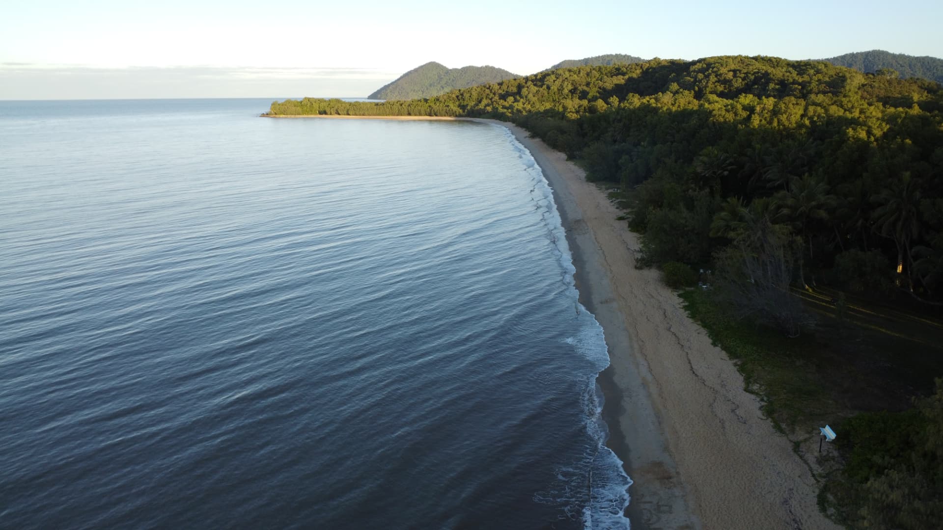 Aerial sunrise view of Bramston Beach with gentle waves